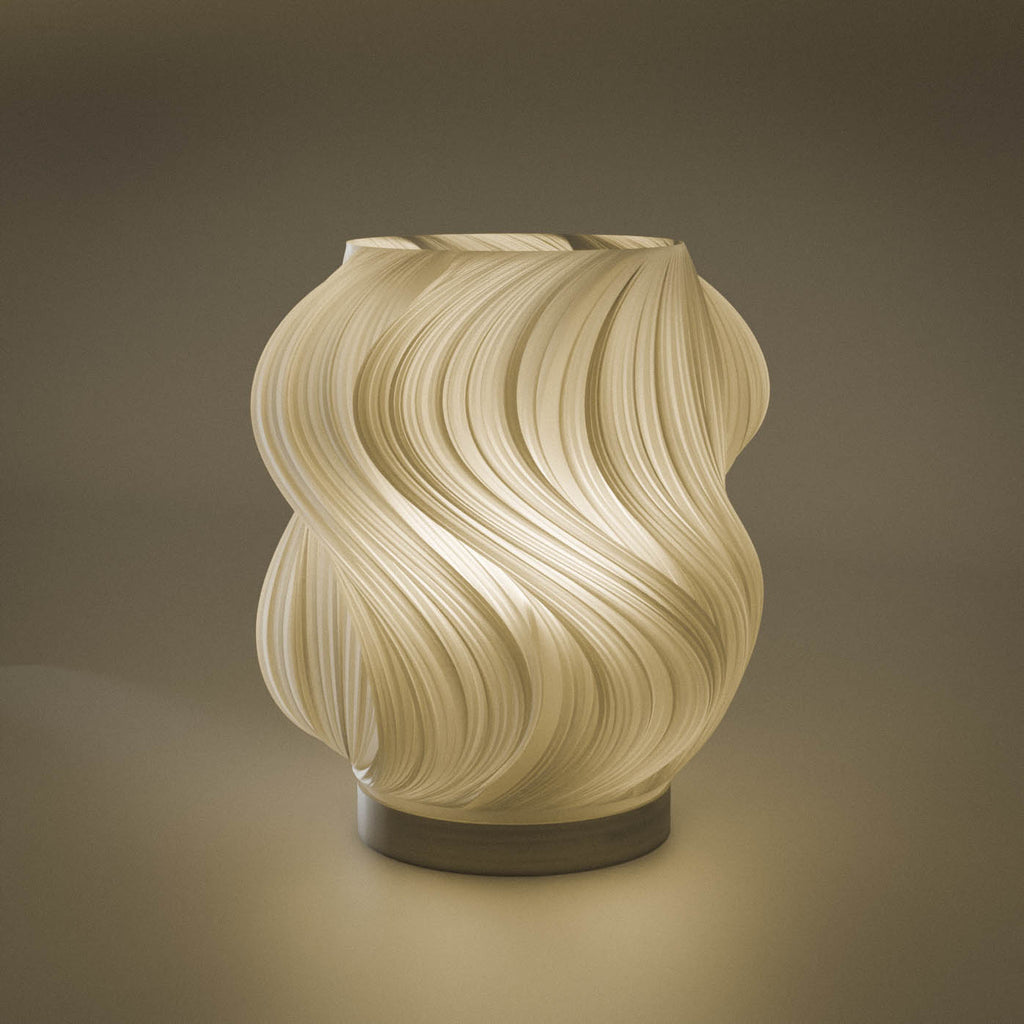 Brisa table lamp with flowing wave-shaped translucent shade