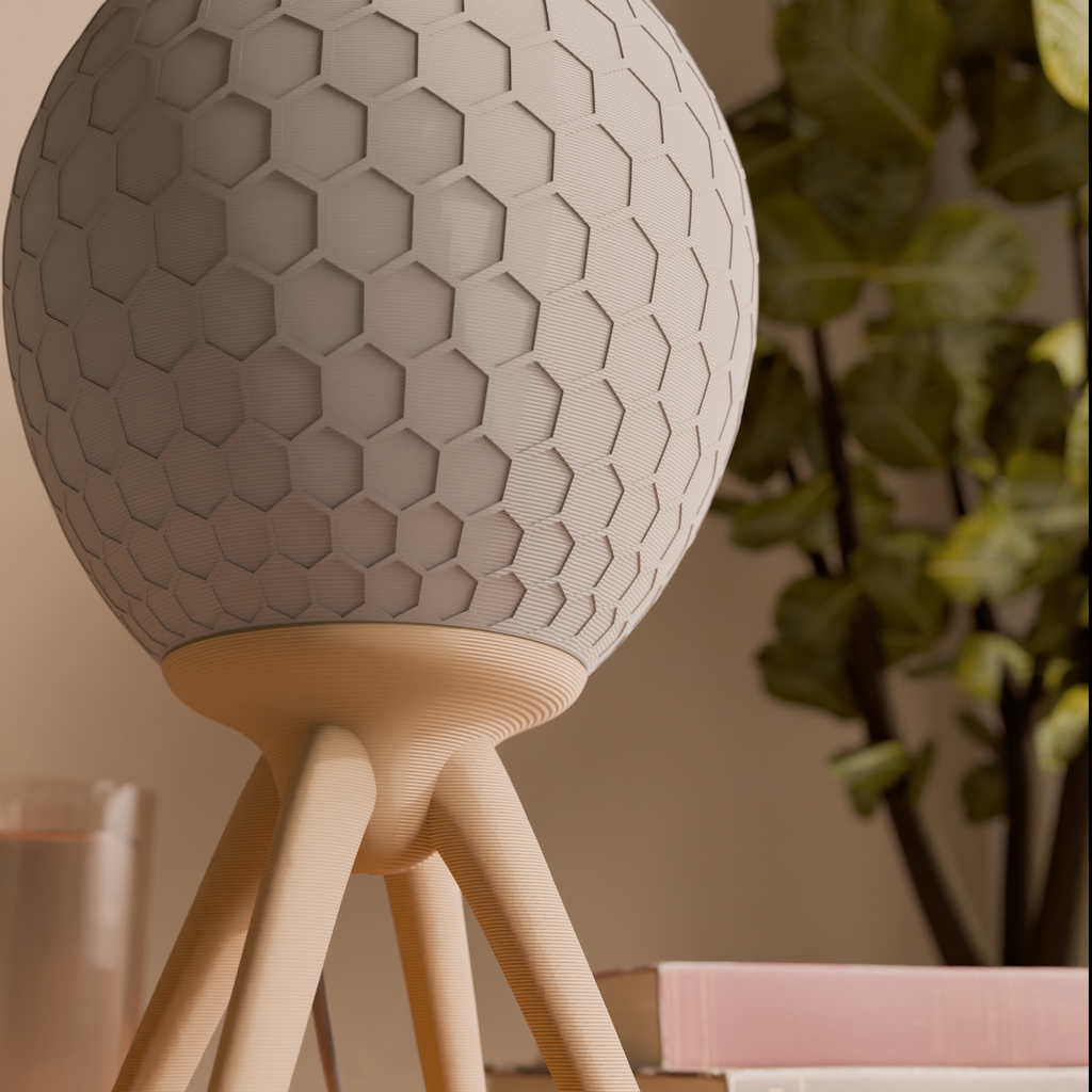 Pollen table lamp with honeycomb-textured shade on tripod base, view 3