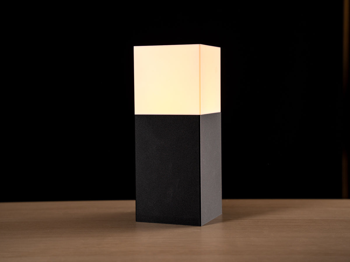 Stele monolithic pillar table lamp with glowing white top