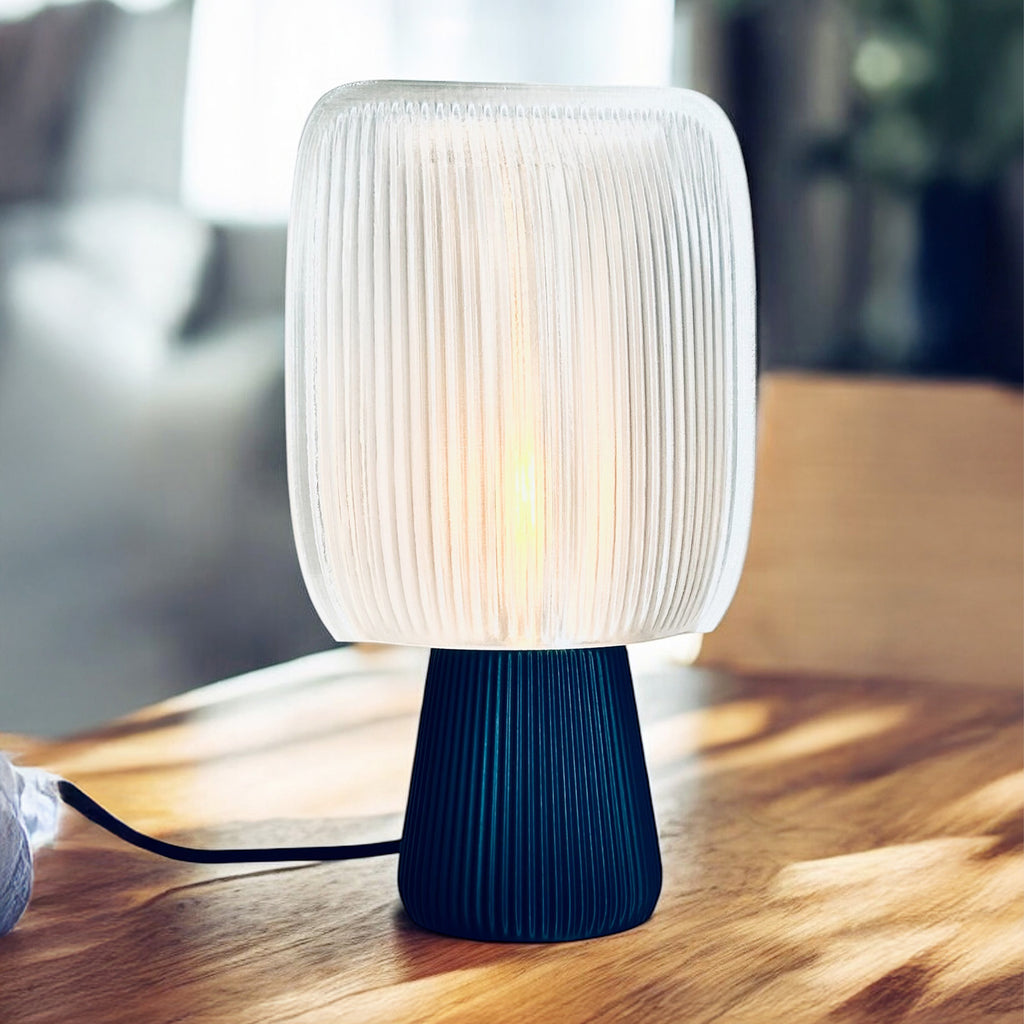 Bliss table lamp with soft pillow-shaped shade on a round base