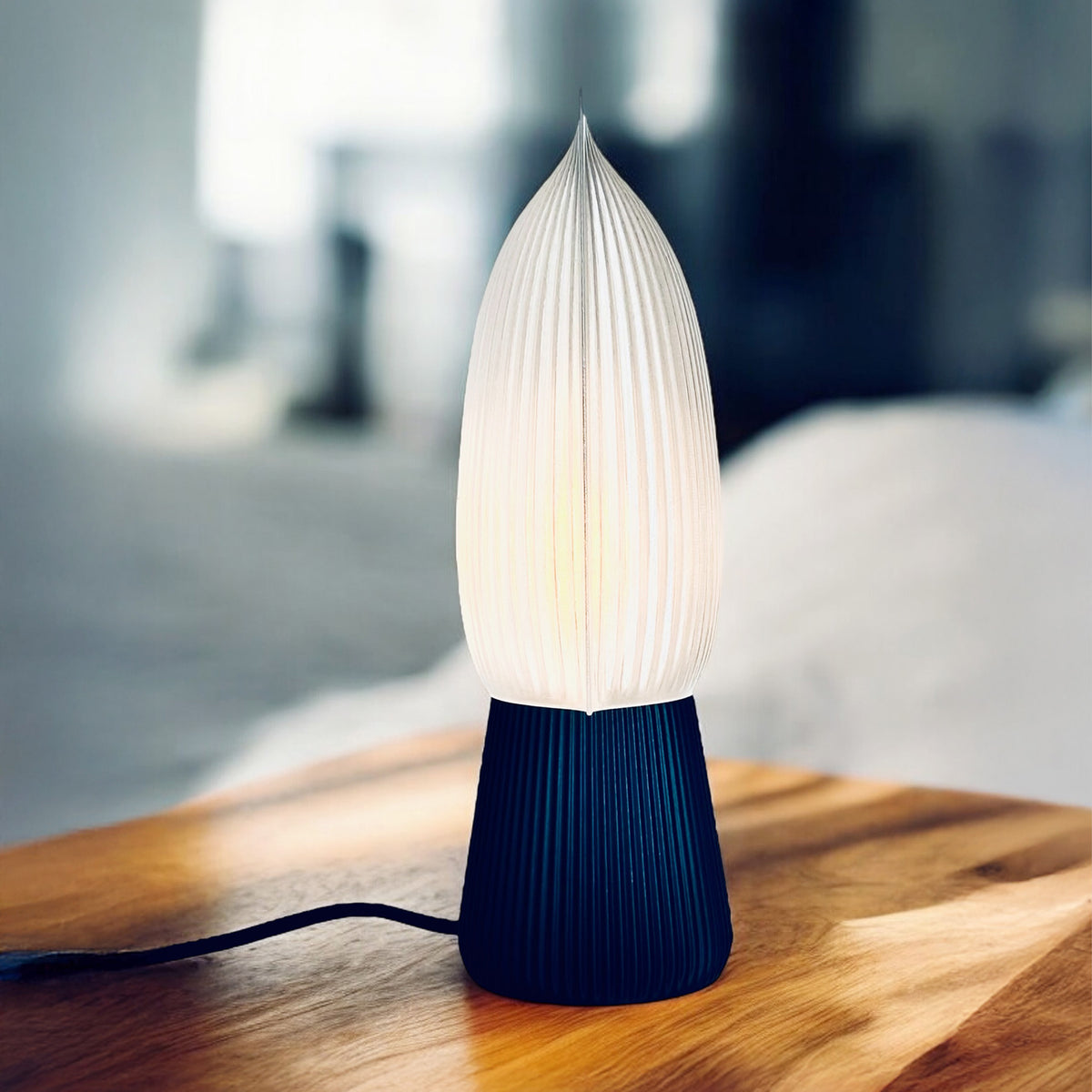 Bliss table lamp with soft pillow-shaped shade on a round base, view 4